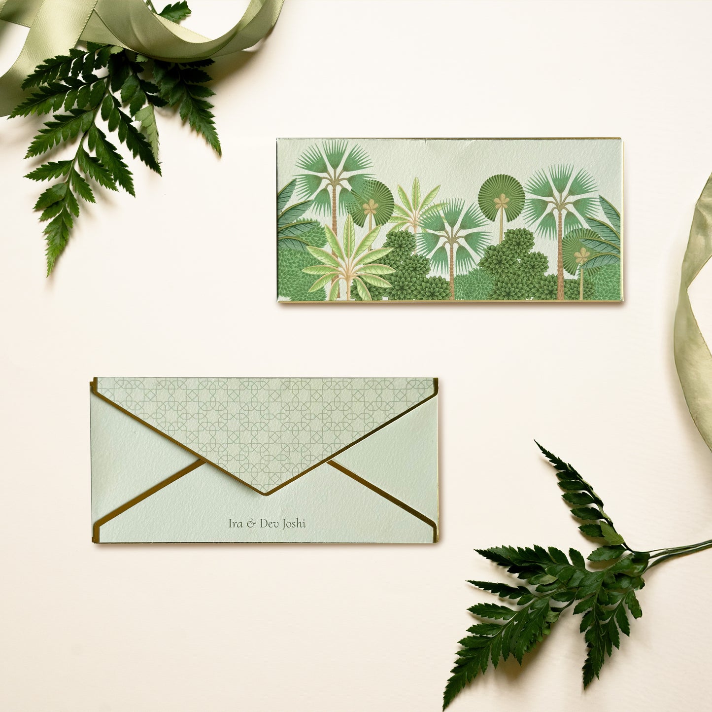 Virena money envelope; box envelope with pichwai inspired jungle illustration on a green background and gold foiled edges