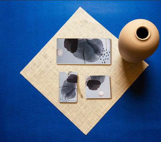 A money envelope, hanging tag and folded card, all in the same abstract blue, white and black print