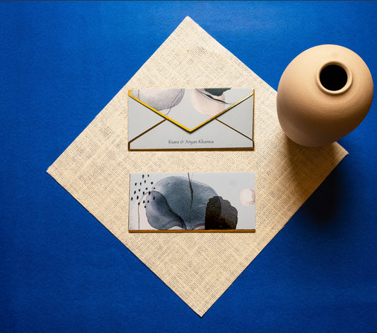 Celeste money envelope; box envelope with a grey, black and white abstract print on a blue background and gold foiled edges

