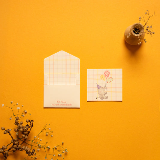 Elphie kids’ notecard; a card with a playful Elephant illustration on a checkered background paired with a matching small envelope