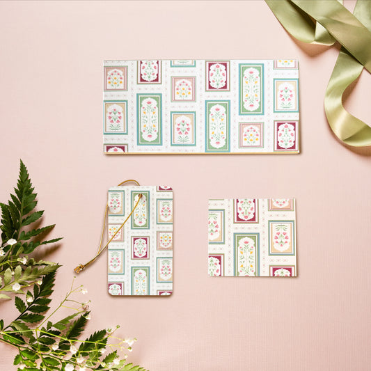 A money envelope, hanging tag and folded card, all in the same print of mughal inspired florals within arches, with a floral border