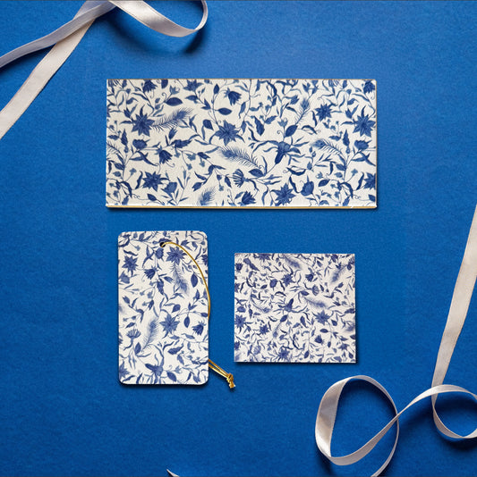 A money envelope, hanging tag and folded card, all in the same blue and white floral print