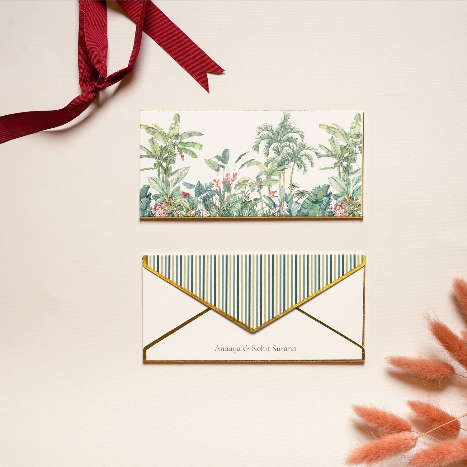 Oasis money envelope; box envelope with a tropical jungle print on a white background and gold foiled edges

