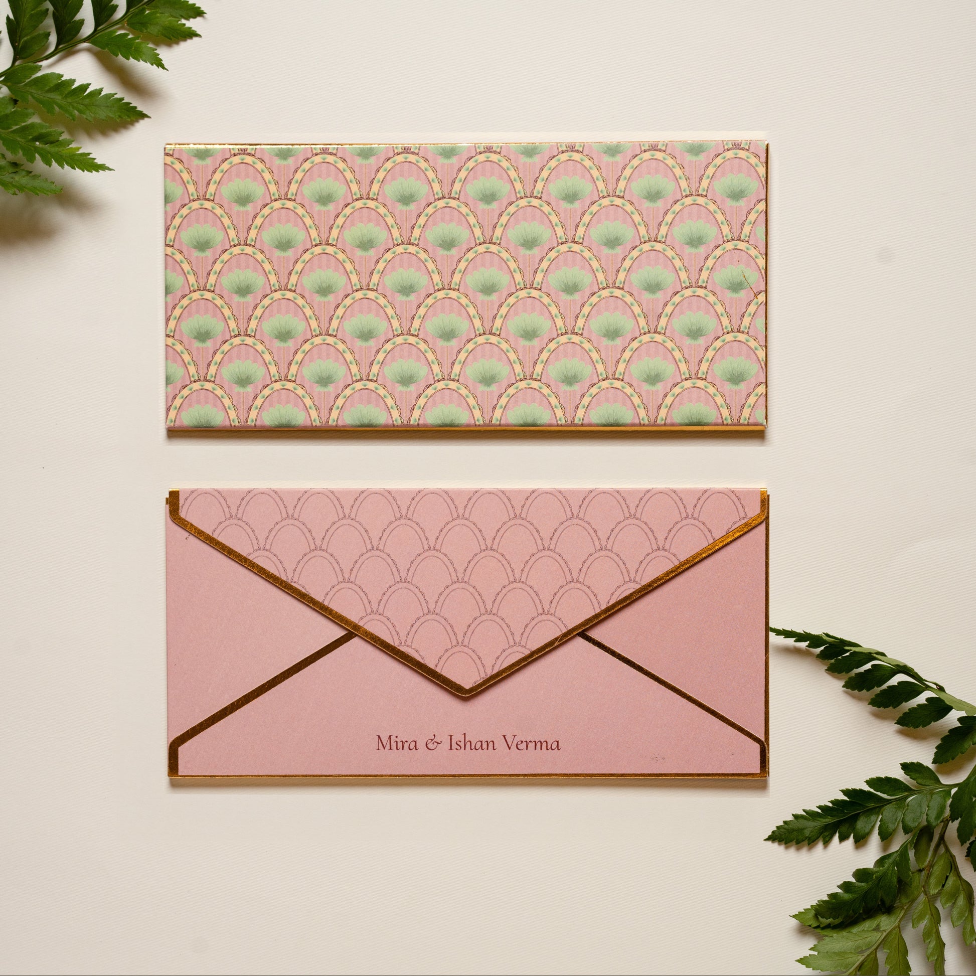 Palmera money envelope; box envelope with a repeating pattern of pink arches with palms and gold foil edges
