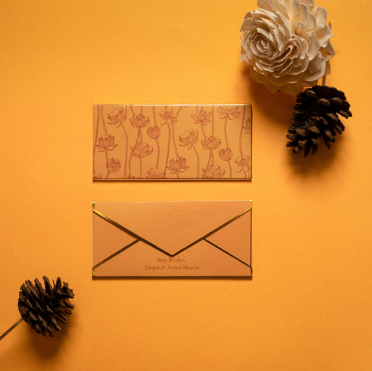 Safira money envelope; box envelope with line drawing lotus pattern on a yellow-orange background and gold foiled edges

