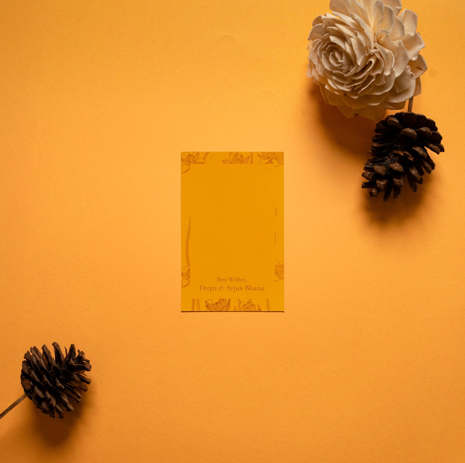 Safira gift tag; a single side printed gift tag with line drawing lotus pattern on a yellow-orange background