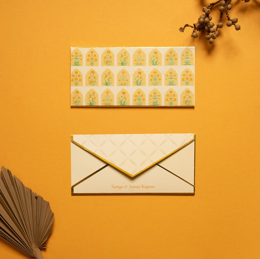 Solenne money envelope; box envelope with a geometric pattern of mughal flowers within arches and gold foiled edges
