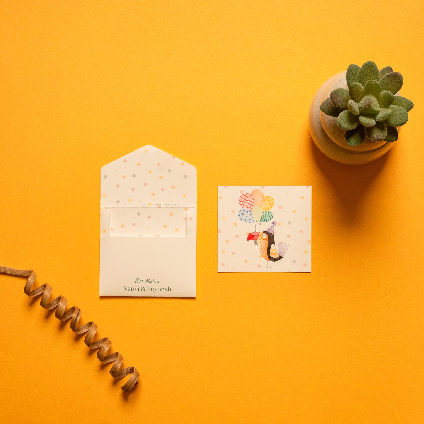 Toco kids’ notecard; a card with a cheerful toucan illustration on a polka dot background paired with a matching small envelope