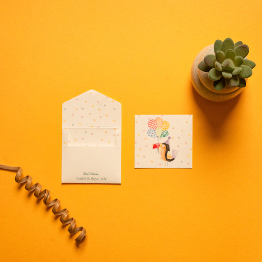 Toco kids’ notecard; a card with a cheerful toucan illustration on a polka dot background paired with a matching small envelope