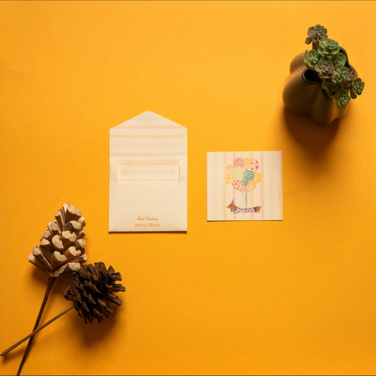 Waggles kids’ notecard; a card with a whimsical dachshund illustration on a stripe background paired with a matching small envelope